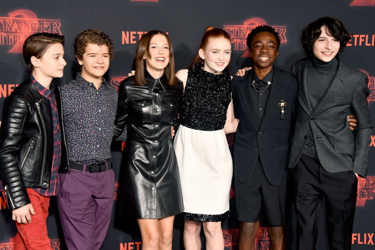 Stranger Things kids get together to wrap presents